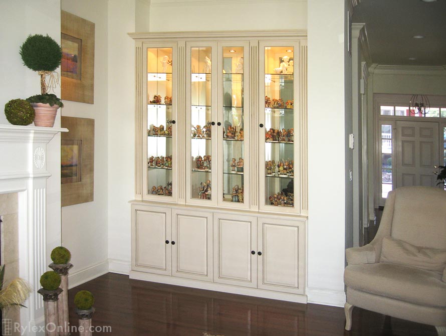 Collectible Cabinet with Glass Doors Shelves and Low Voltage Lighting