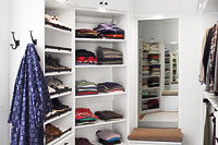 His and Her Closets with Storage Bench
