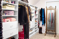 Sloped Ceiling Transformed to Powerhouse Closet