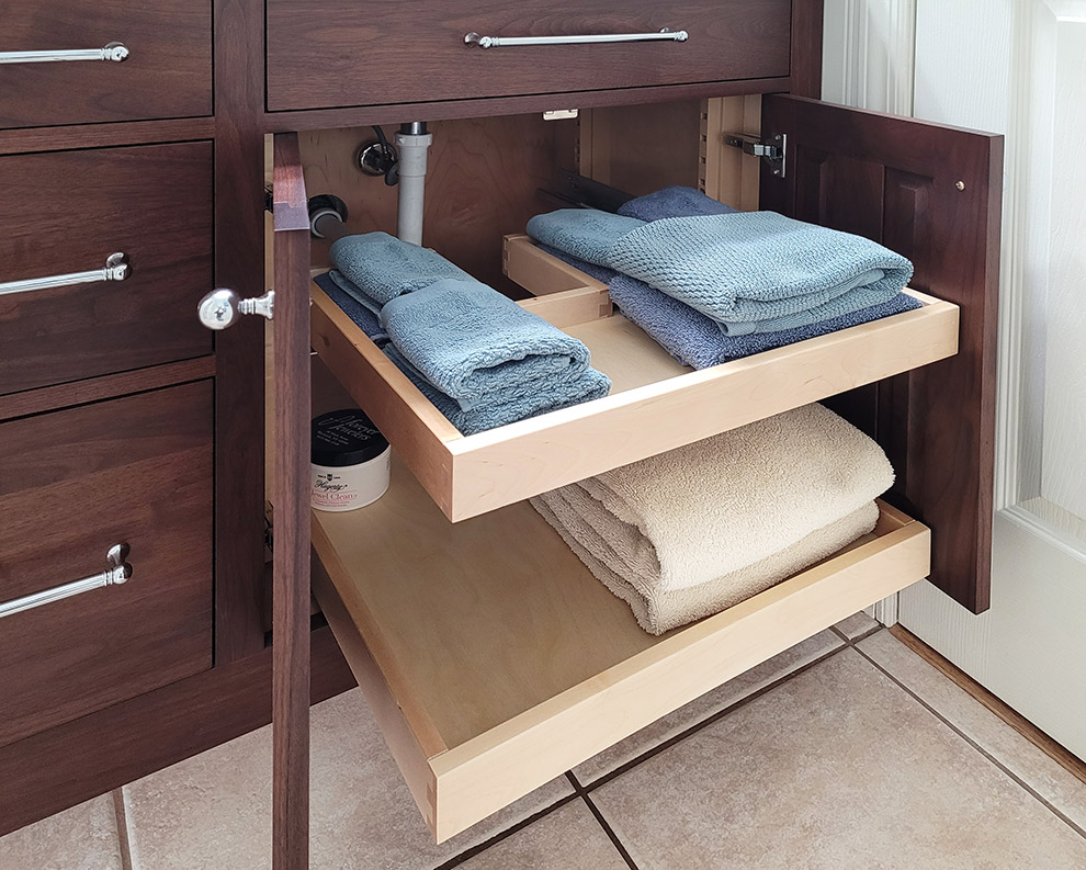 Cabinet Pullout Out Wraps Around Plumbing to Maximize Storage