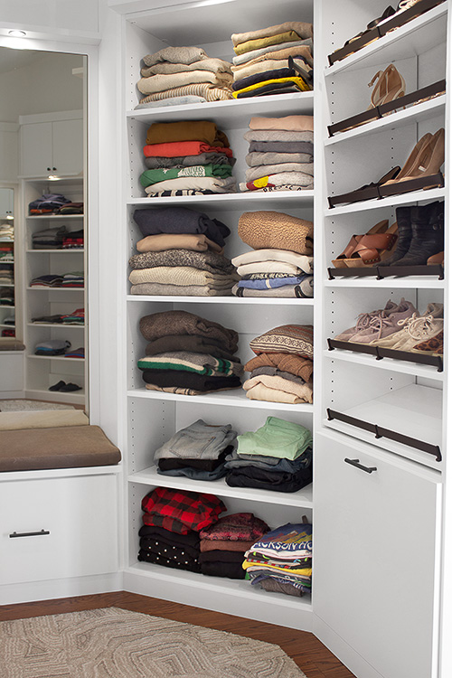 Custom Closet with Tilt Out Hamper and Angled Shoe Shelves