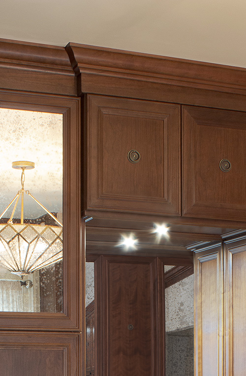 Closet Cabinets Crown Moulding and Mercury Glass Door Inserts Close Up