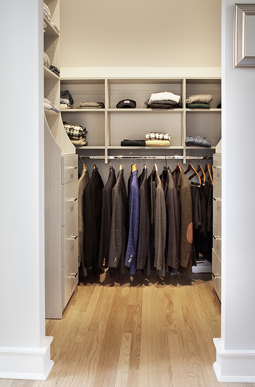 Dual Master Closet Showing Men's Closet with Open Shelving and Hutch