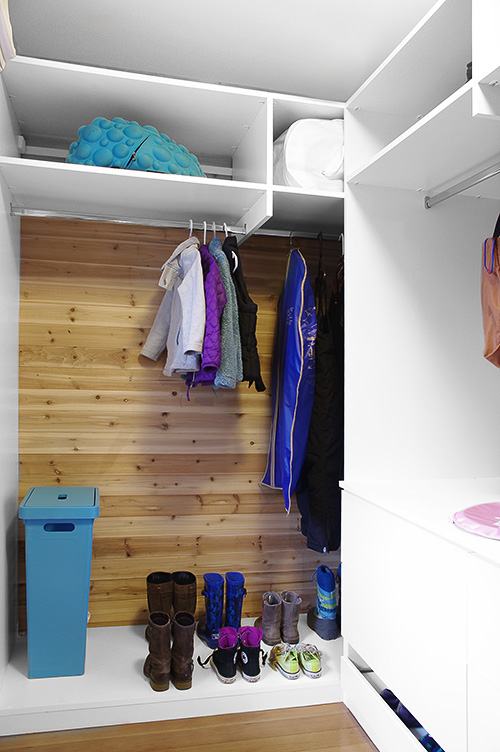 Girl's Closet with Open Shelves and Continuous Hanging Rod and Cedar Wall