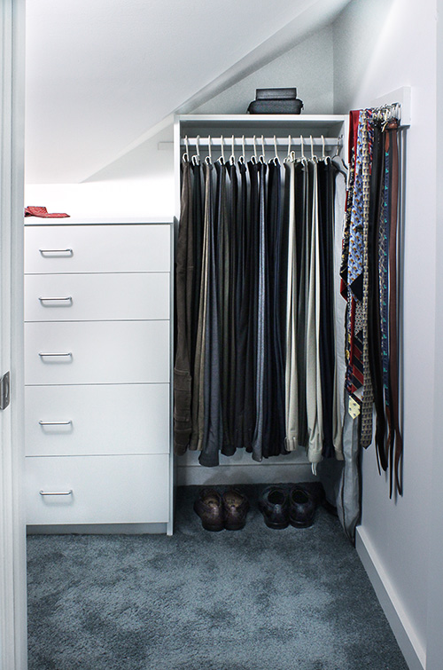 Angled Closet Wall with Pant Hanging Space and Tie Rack