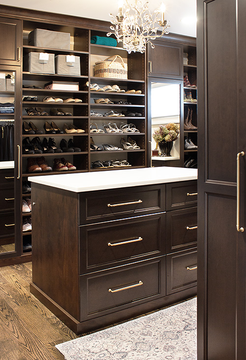 Primary Closet with Island Storage Drawer Cabinet and Spacious Shoe Shelves