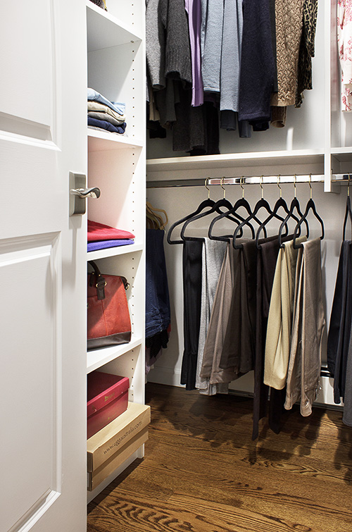 White Walk-In Closet Lower Hanging Space and Open Shelving