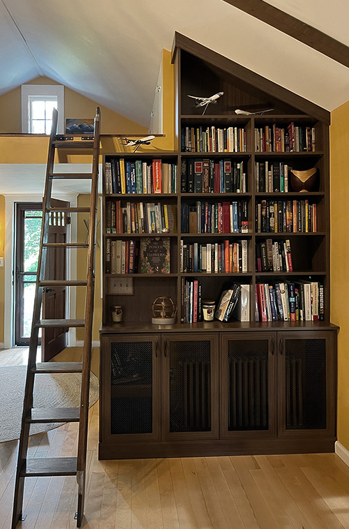 Living Room Bookcase and Cabinet Mesh Doors Concealing Radiator