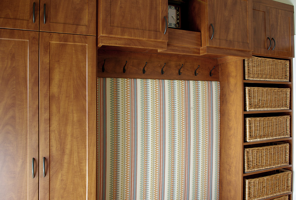 Cabinet Door Conceals Shoe Cubbies, Coat Hooks and Shelf Baskets Close Up