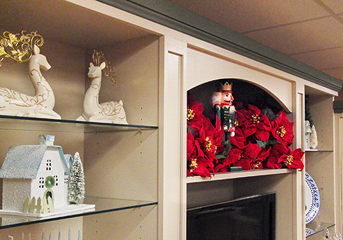 Display Cabinet with Open Glass Shelves and Crown Moulding Close Up