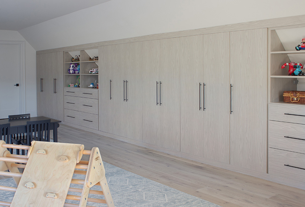 Extensive Built-In Playroom Storage Cabinets