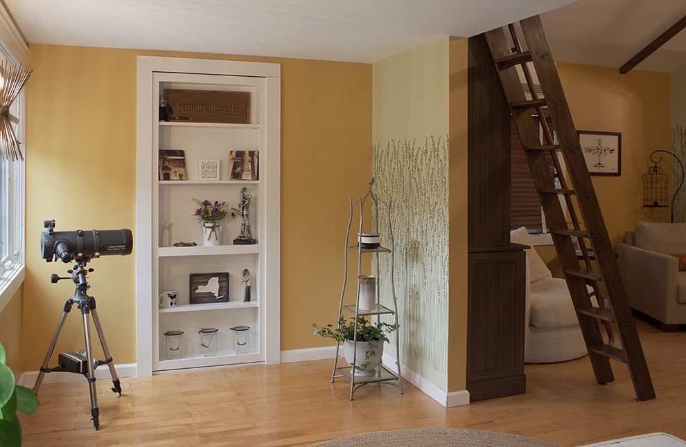 Bookcase Door Conceals a Coat Closet