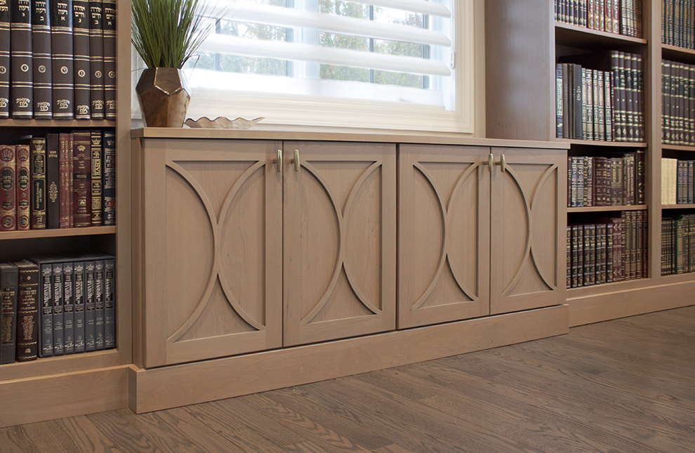 Library Storage Cabinet Flanked by Bookcases