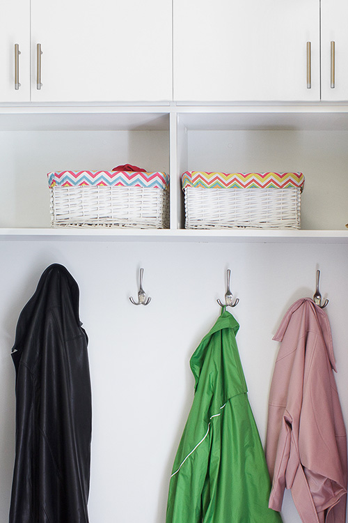 Mudroom with Hooks and Storage Cabinets with Open Shelves Close Up