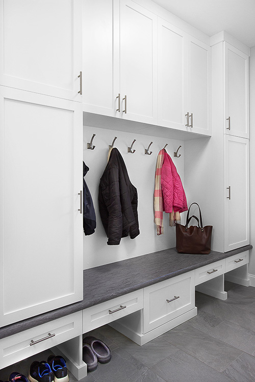 Mudroom with Cabinets and Bench Off Garage