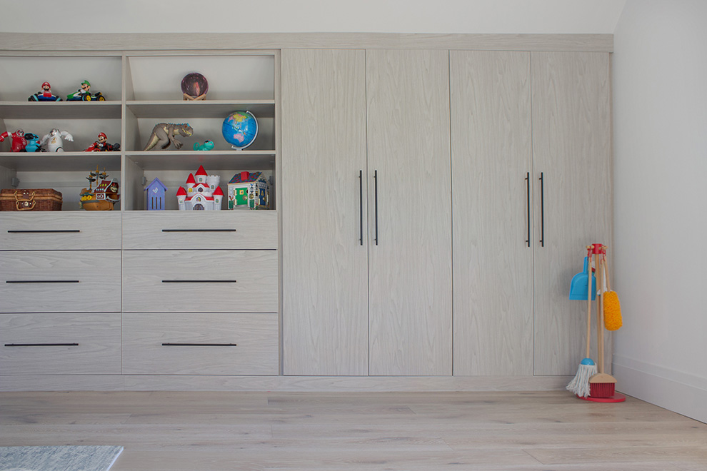 Organized Playroom Cabinets with Open Shelves and Storage Drawers