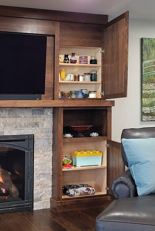 Fireplace Surround Cabinets with Multi-Level Cabinet Depths to Accomdate Deeper Items and Shallow Items