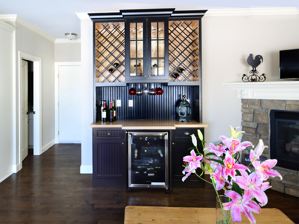 Ebony Home Bar Dual Wine Cabinets, Hanging Stemware, Glass Door Cabinet with Butcher Block Counter and Two Lower Cabinets with Drawers Frame a Wine Cooler