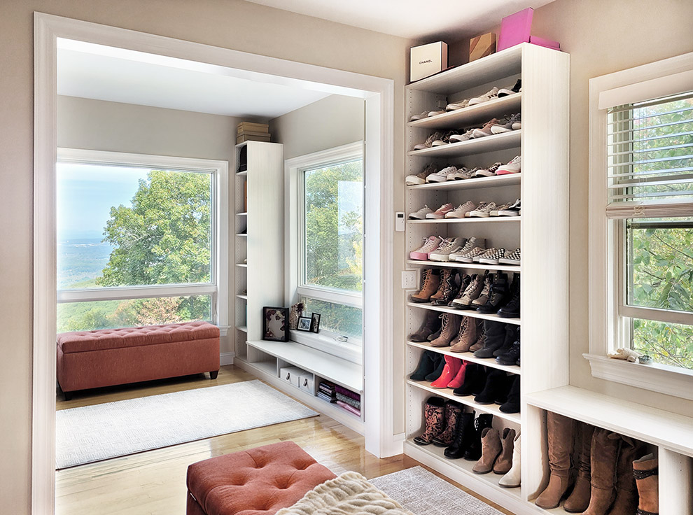 Primary Walk-In Closet with Shoe Storage and Shoe Shelves