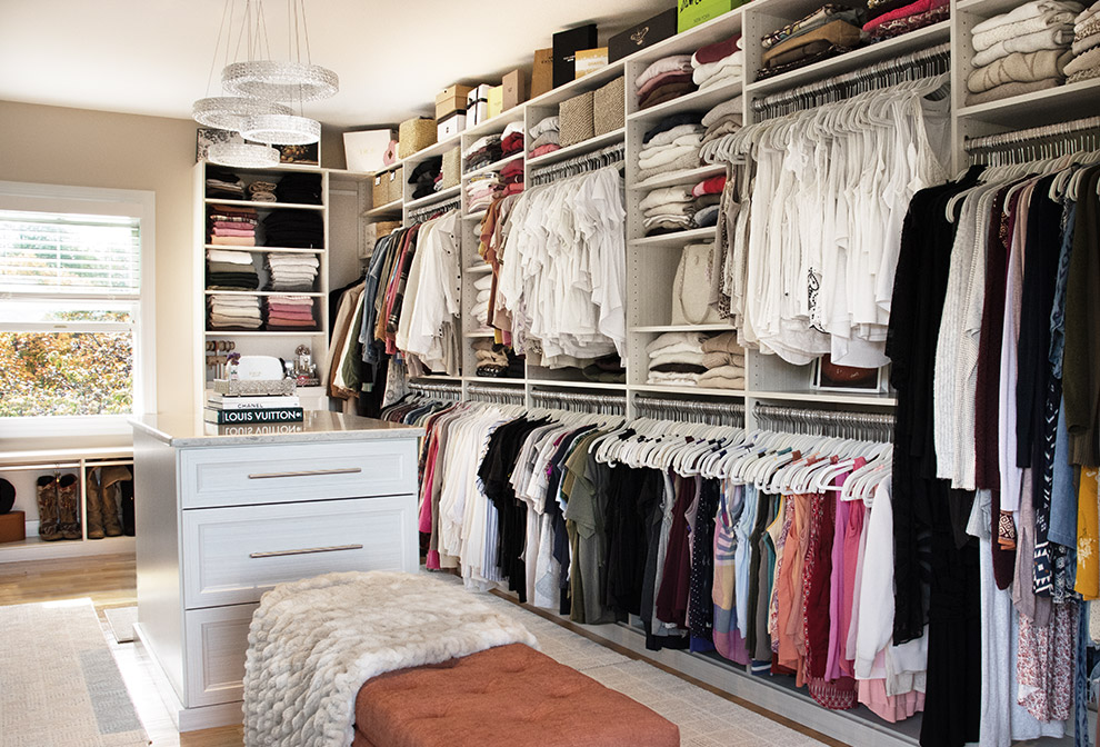Primary Walk-In Closet with Closet Island Drawers and Open Shelving