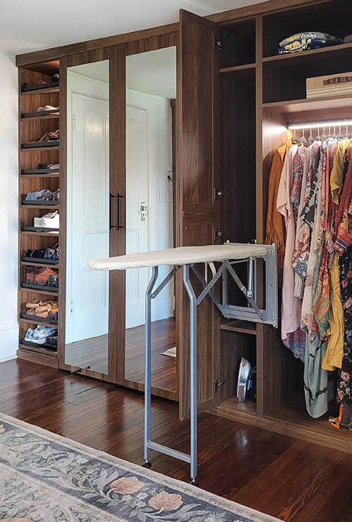Primary Closet with Foldaway Ironing Board, Hanging Space & Adjustable Shoe Shelves - View More Options