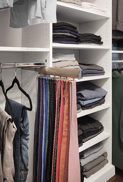 Primary Walk-In Closet with Sliding Valet Rod