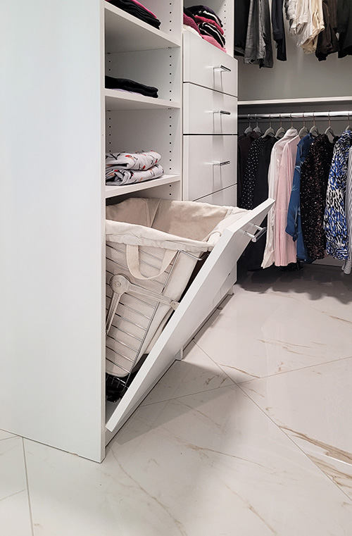 Walk-In Closet with Jewelry Drawers and Concealed Laundry Hamper