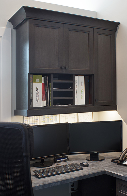 Office Workspace with Paperwork Cubbies and Under Cabinet Lighting