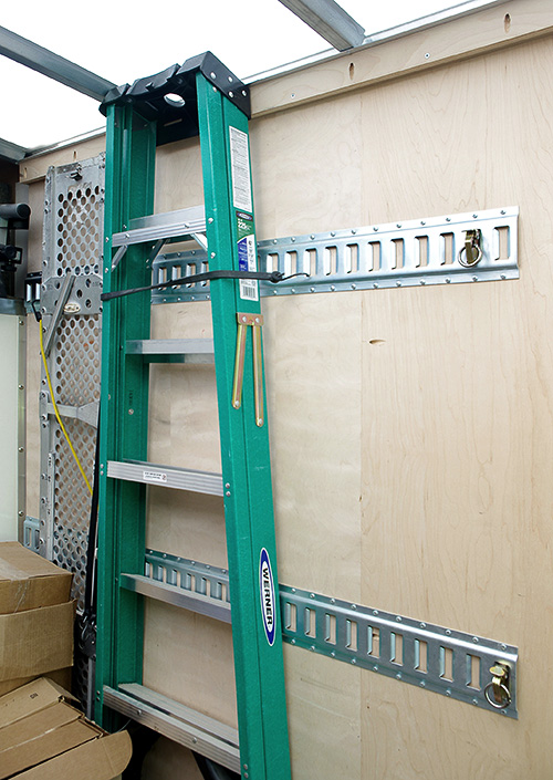 E Track Keeps Cargo Safe on Wall for Transport