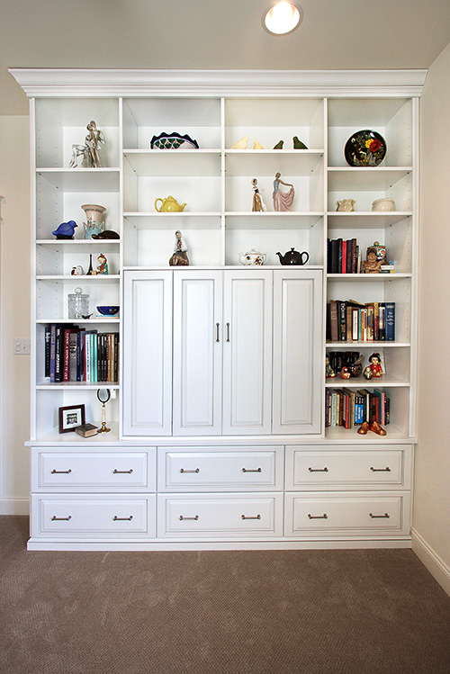 Entertainment Center with Guest Room Storage Drawers and Display Shelves