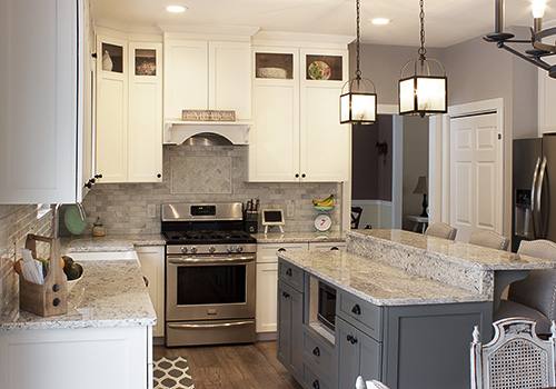 Kitchen Island Framed by Contrasting Cabinets