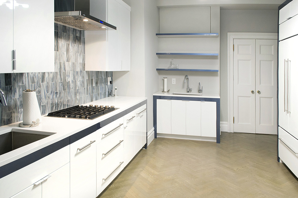 Sleek Kitchen Cabinets with Cobalt Blue Metallic Detailing