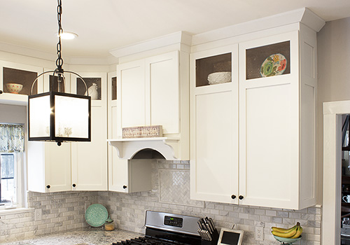 Custom Range Hood and Cabinets with Seed Glass Door Inserts