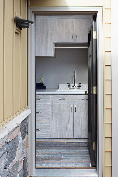 Compact Laundry Room with Foldaway Ironing Board