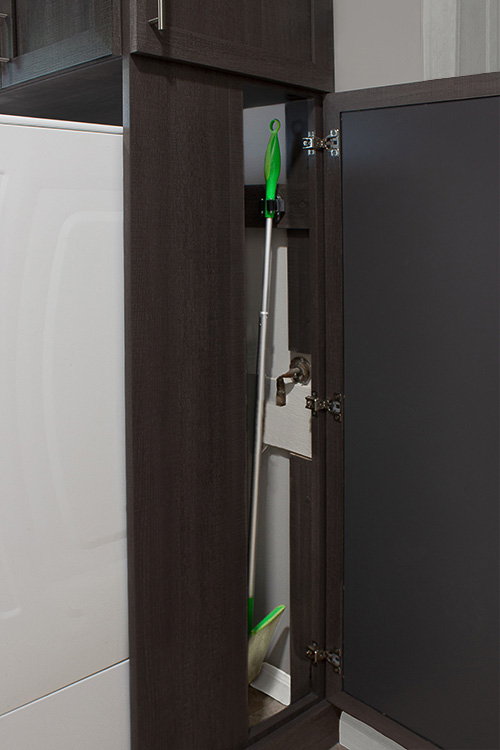 Cabinet with Concealed Mop and Broom Hooks