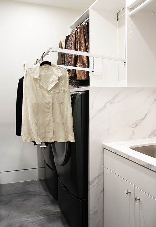 Custom Laundry Room White Cabinets with Pull-Down Rod and Sink Cabinet