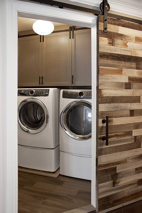 Umbra Mini Barn Door Hardware on Laundry Cabinets