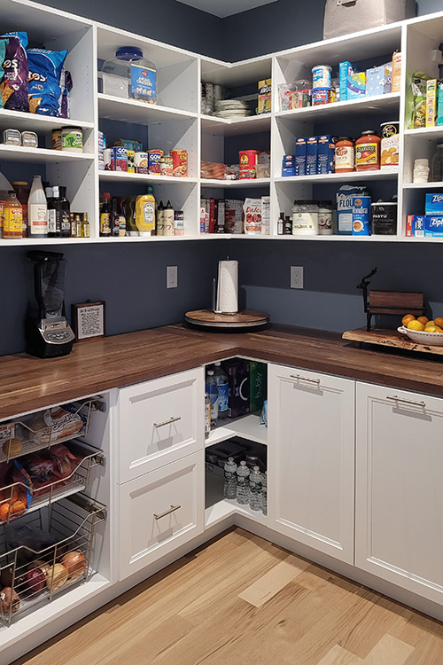 U-Shaped Pantry with Butcherblock Counter and Sliding Baskets