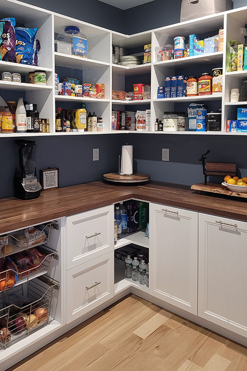 U-Shaped Pantry with Butcherblock Counter and Sliding Baskets