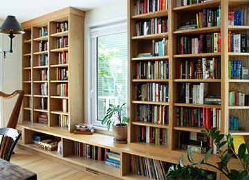 Ceiling-Height Bookcases Built on Existing Bench
