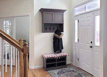 Custom Mudroom Cabinets at Garage Entryway with Storage Cabinets and Coat Hooks